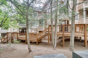 A wooden deck with a staircase leading to a building. - All-Season Fun! Wintergreen Resort Condo w/ Views (Wintergreen Resort)