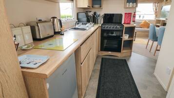 Fridge, electric kettle, toaster, cookware/dishes/utensils