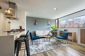 Luxury Apartment | Living area | 43-inch flat-screen TV with cable channels, TV - Go Living and Suites by Jalo (Medellín)