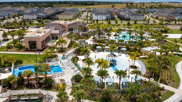 A residential area with multiple houses, a swimming pool, and a playground. - Fabulous 9BD 6B Avatar Movie Harryporter Sleep24 (Kissimmee)