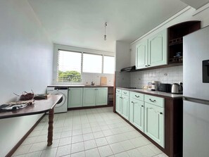 Fridge, microwave, stovetop, coffee/tea maker