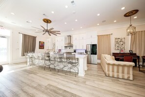 Enjoy meals and socialize around the central island in this spacious kitchen and living area.