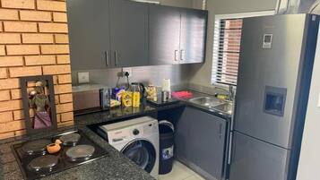 Comfort Apartment | Private kitchen | Full-sized fridge, microwave, oven, dishwasher