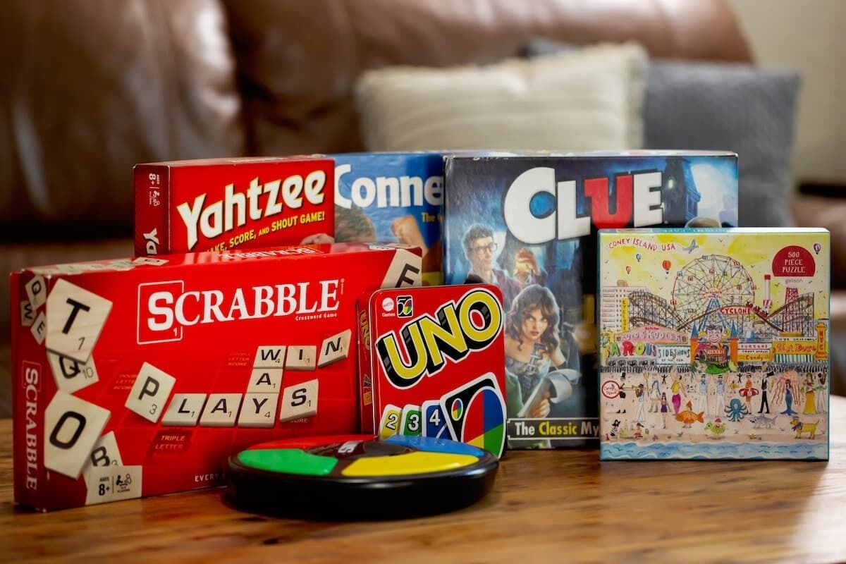 A variety of board games including Scrabble, Yahtzee, Uno, and Clue.
