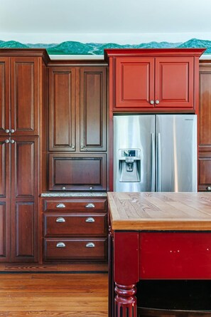 A kitchen with wooden cabinets, a stainless steel refrigerator, and a wooden countertop. - Clonmel Acres: Hot Tub + Mins to Hazy Mtn & BMB (Afton)