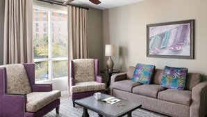 A hotel room with two armchairs, a sofa, a coffee table, and a lamp. - 2 Bed 2 Bath Las Vegas - Pools, Hot Tubs, Cabanas and More! (Las Vegas)