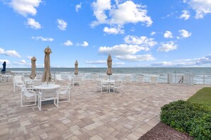 Outdoor dining - Ocean Club North A101 - direct, oceanfront views! (New Smyrna Beach)