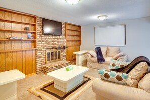 TV, fireplace, books - Spacious Family Home: 11 Mi to Dtwn Minneapolis! (Minneapolis)