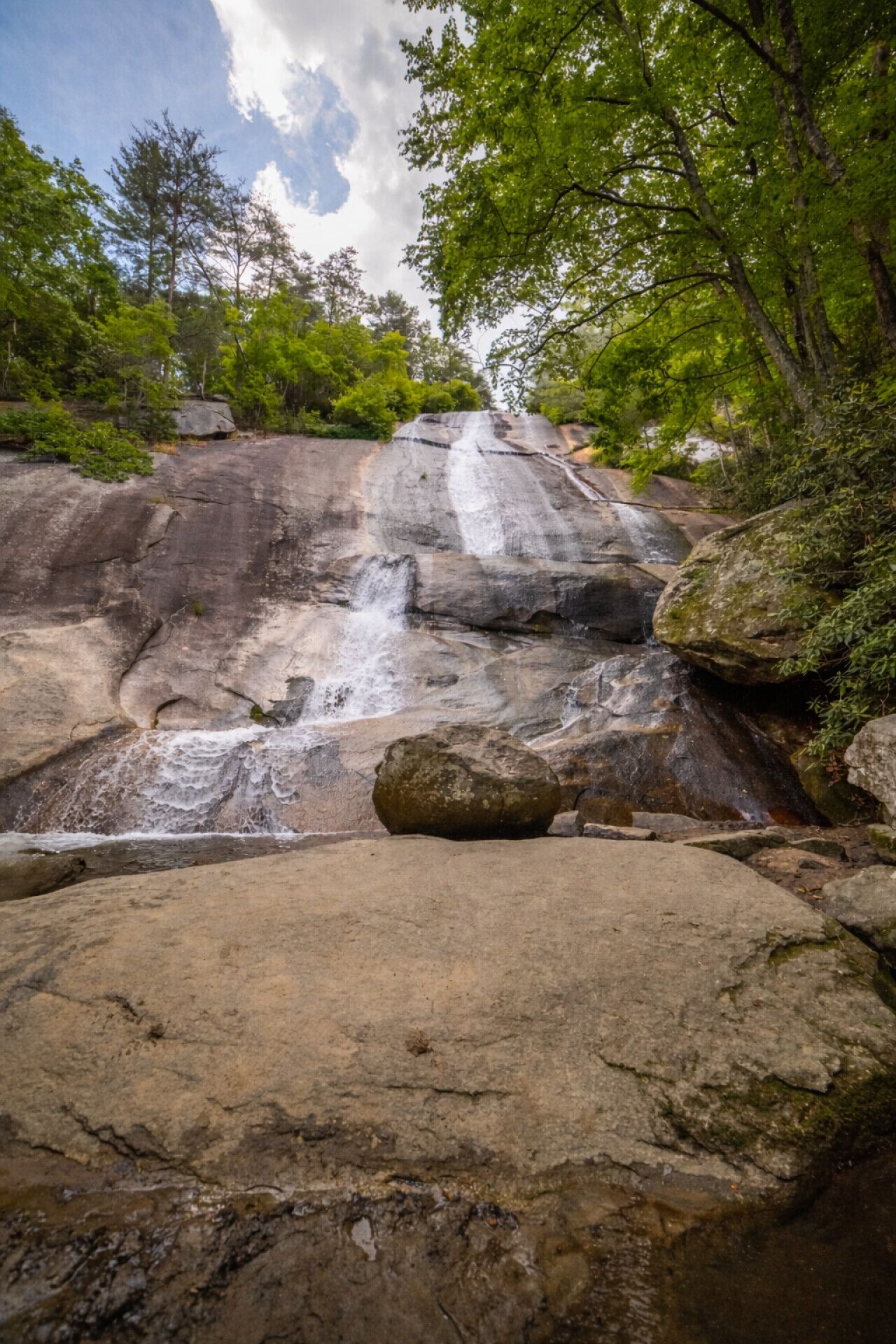 A natural rock formation with a waterfall.