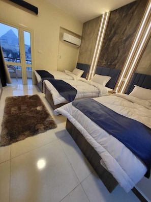 Chambre Triple Luxe, vue ville | 1 chambre, chambres insonorisées, Wi-Fi gratuit