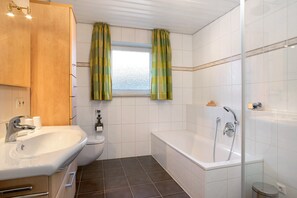 Bathtub, hair dryer, towels