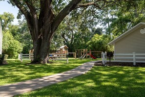 Enjoy a peaceful family outing in this serene park setting with a playground and shelter.