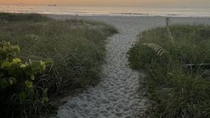 A sandy beach path leading to the ocean with a sunset in the background. - 3 Bed 2 Bath House - Blocks to the Beach - 40 Foot Pool! (Cape Canaveral)