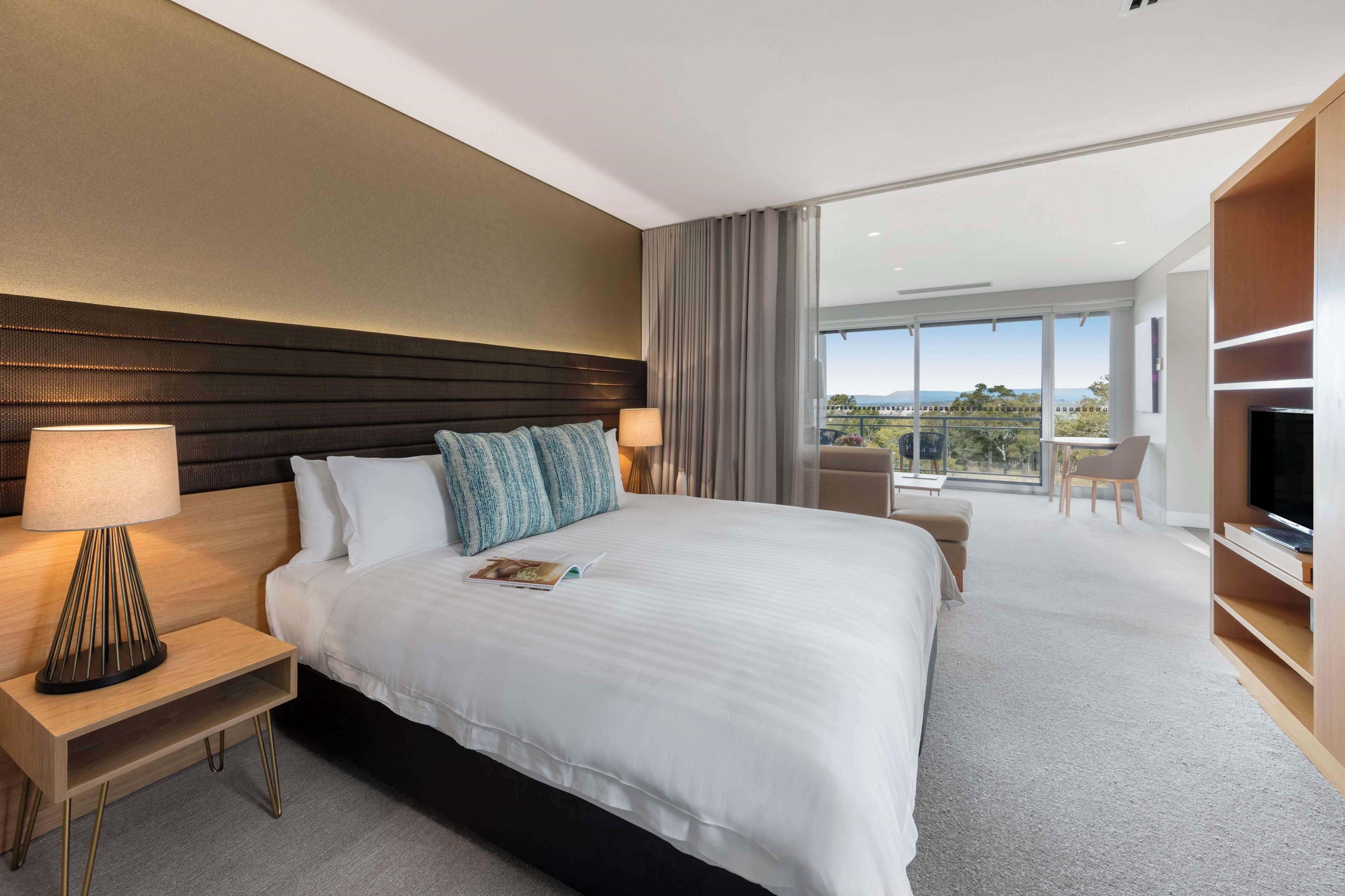 Desk, iron/ironing board, bed sheets