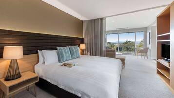 Desk, iron/ironing board, bed sheets