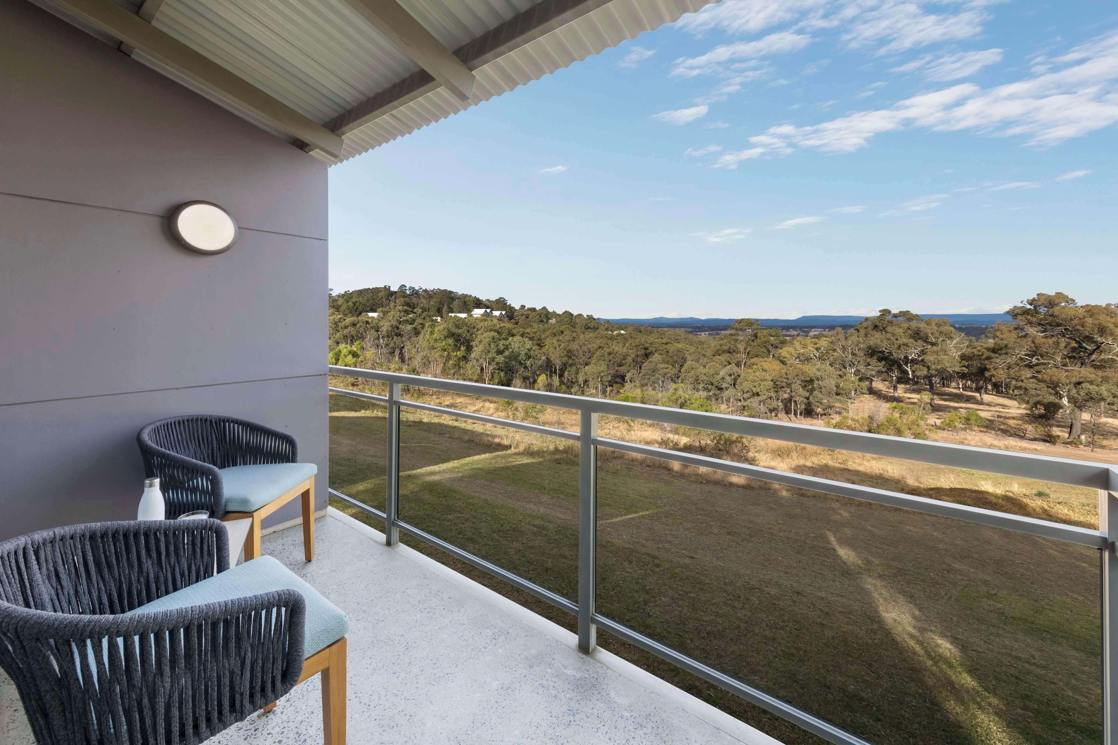 Desk, iron/ironing board, bed sheets