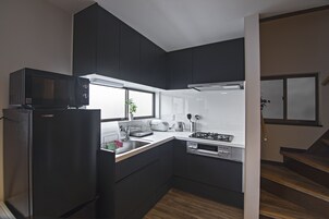 Superior Villa | Private kitchen | Fridge, microwave, stovetop, electric kettle