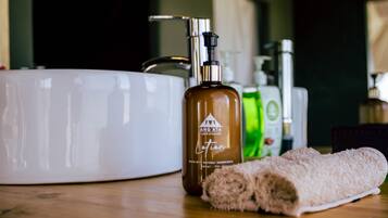 Shower, rainfall showerhead, towels, soap