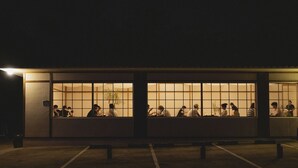 A building with large windows, a sign with the number 173, and people sitting inside. - uonstay (Gyeongju)