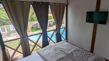 Deluxe Bungalow, 1 Bedroom, Pool Access, Pool View | 1 bedroom, desk, laptop workspace, rollaway beds