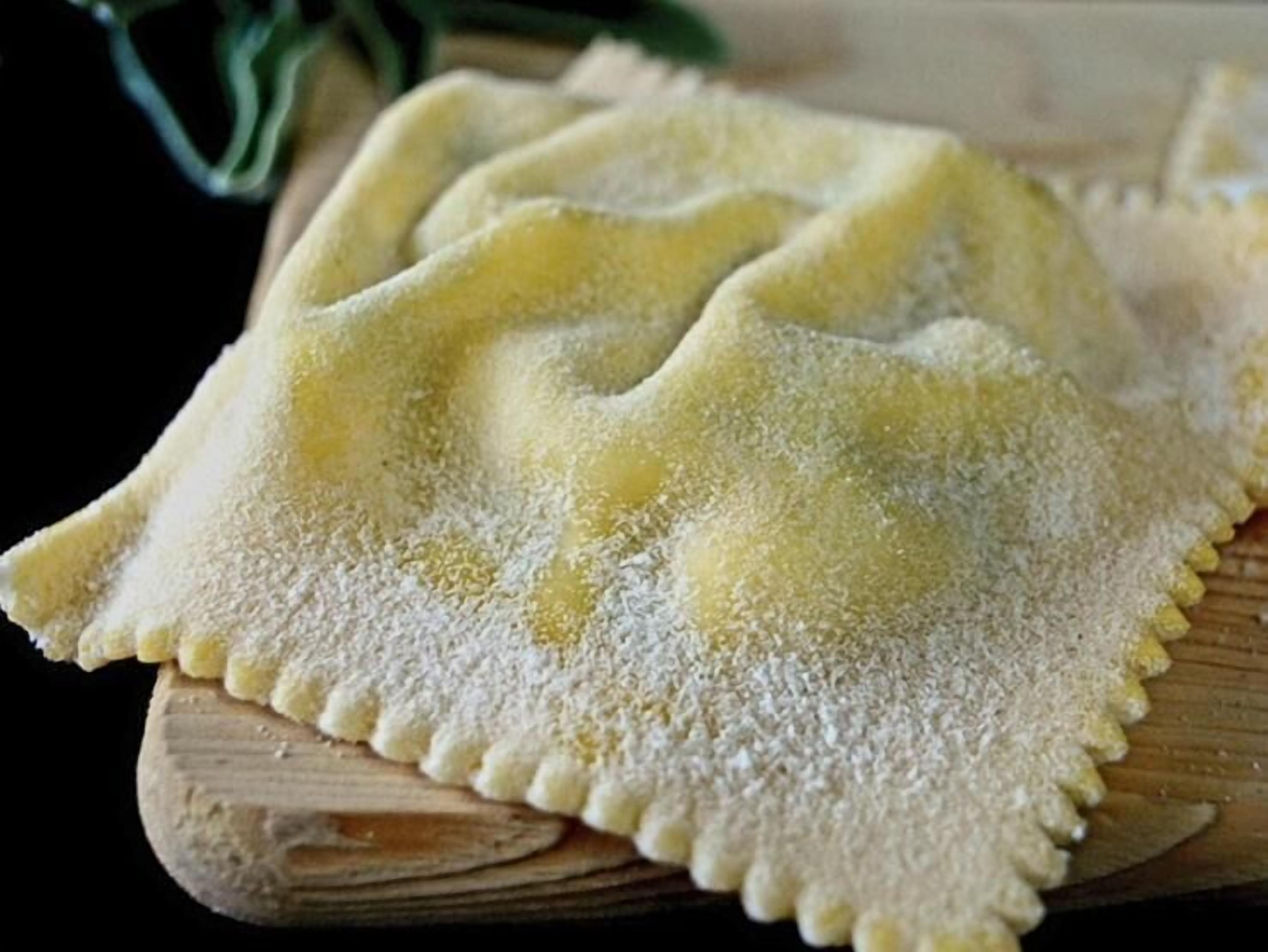 Ravioli on a wooden board.