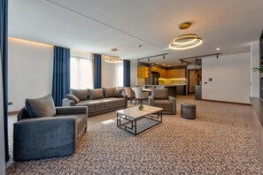 Royal Apartment | Living area | 40-inch flat-screen TV with cable channels, TV