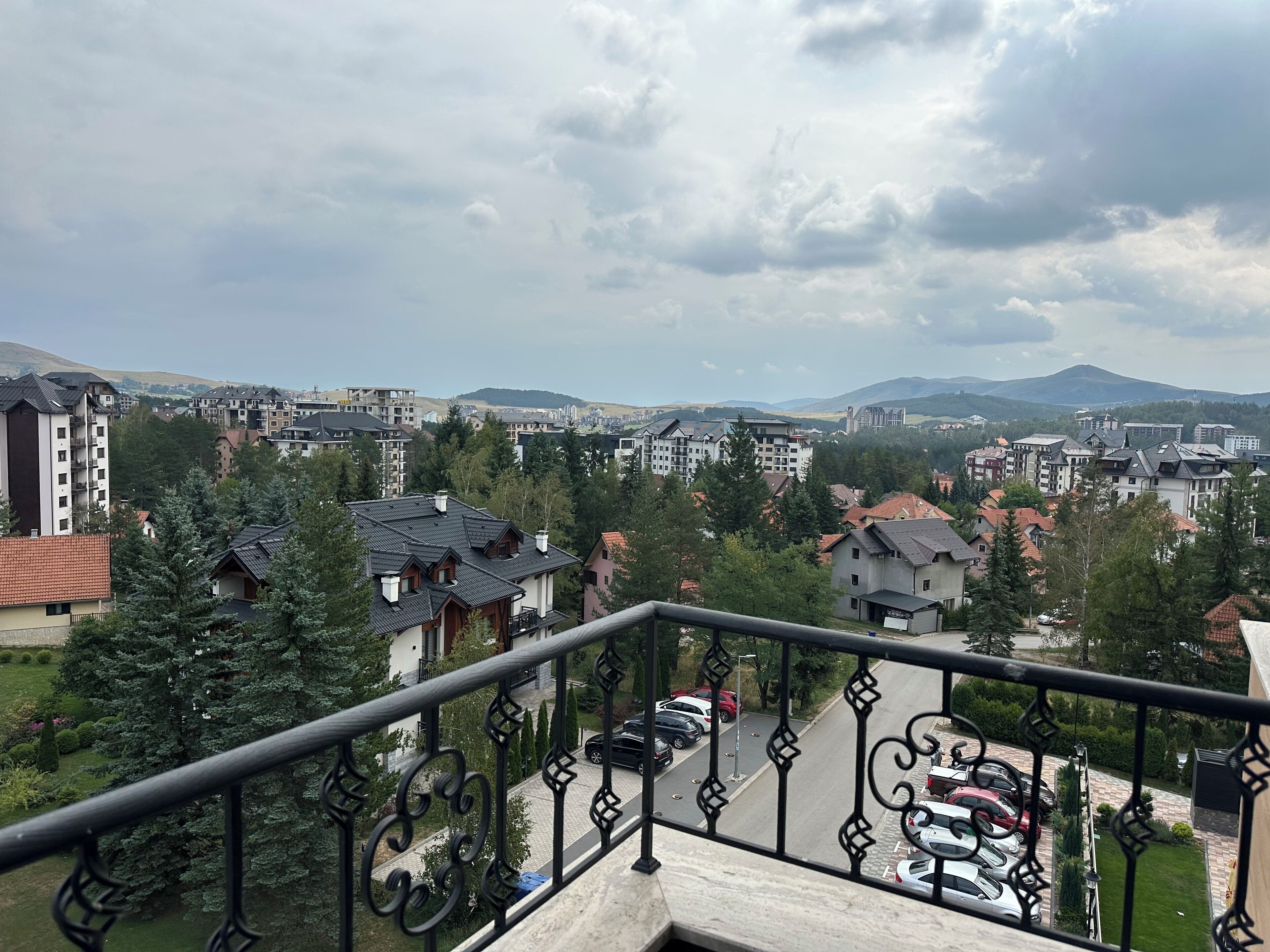 A residential area with various buildings, including multi-story apartment complexes and single-family homes.