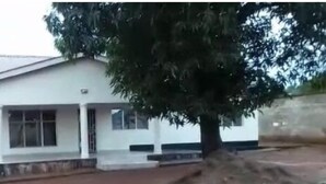 A single-story building with a flat roof and a porch. - Zambia (Chipata)