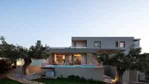 A modern two-story house with a swimming pool, outdoor seating, and a well-maintained garden. - Rizes Villa with Jacuzzi & Heated Pool, A Nature Paradise! (Rethymno)