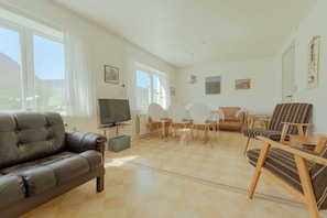 Standard House | Living room | 40-inch flat-screen TV with satellite channels - Sea And Mountain View | Scenic Village | 2Br House (Vidareidi)