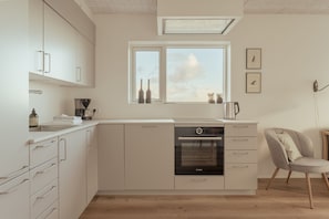Apartamento, 2 quartos, vista para o mar | Cozinha privada | Geladeira grande, fogão, cooktop, lava-louças