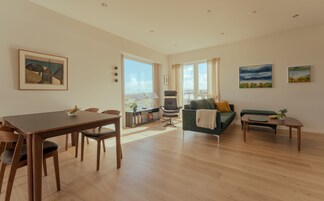 Apartment | Living area | 50-inch flat-screen TV with satellite channels, video-game console