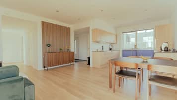 Apartment | Living area | 50-inch flat-screen TV with satellite channels, video game console