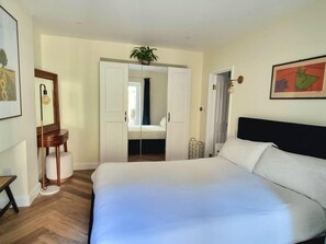 Departamento | 1 habitación, tabla de planchar con plancha, wifi gratis y ropa de cama 