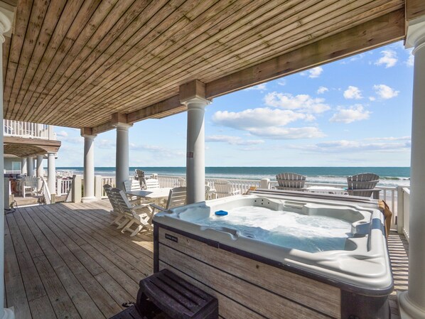Relax on the deck with Adirondack chairs and enjoy the ocean view from the comfort of a hot tub.