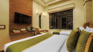 Quarto triplo premium | 1 quarto, ferros/tábuas de passar roupa, Wi-Fi de cortesia