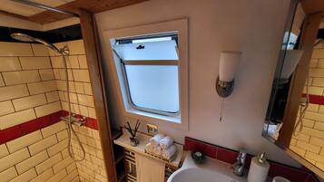 Shower, towels, soap, toilet paper