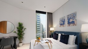 A modern hotel room with a bed, a desk, a potted plant, and artwork on the walls. - Maison Privee - Sleek and Sunny Apt in Business Bay w/ Canal Views (Dubai)