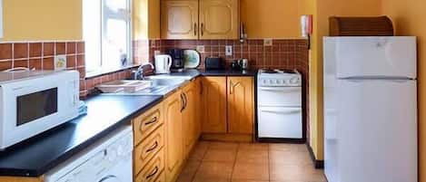 Microwave, oven, high chair, cookware/dishes/utensils