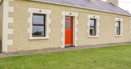 GLOR COTTAGE, pet friendly, with a garden in Knock, County Mayo