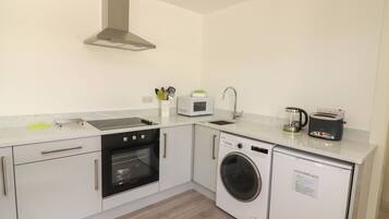 Fridge, microwave, oven, cookware/dishes/utensils