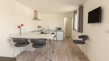 Fridge, microwave, oven, cookware/dishes/utensils