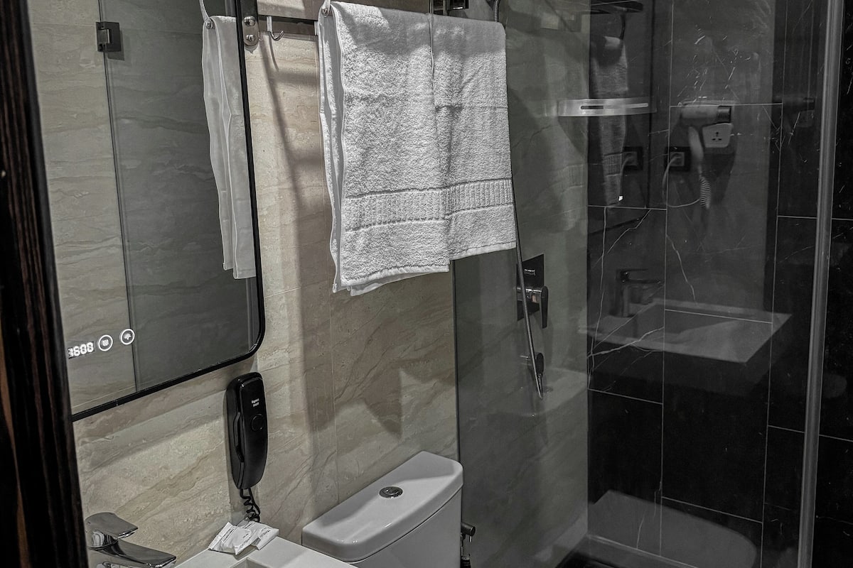 Shower, free toiletries, hair dryer, towels