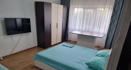 5 minutes to the beach! Family sized apartment with a nature park view.