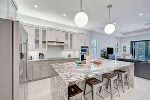 Fridge, microwave, oven, stovetop - 3BR modern masterpiece with enclosed pool and bikes - snowbird-friendly (Naples)