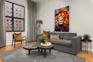 Deluxe Apartment | Living area | 40-inch flat-screen TV with cable channels, Netflix, streaming services - Docklands 118 (Cape Town)