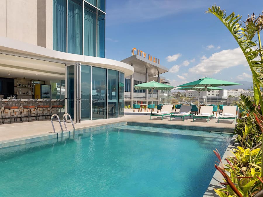 Outdoor pool, pool umbrellas, sun loungers