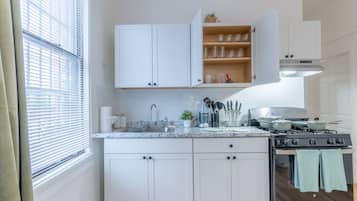 Fridge, microwave, stovetop, coffee/tea maker