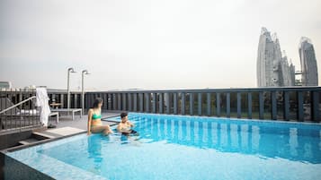 Outdoor pool, open 7:00 AM to 9:00 PM, sun loungers