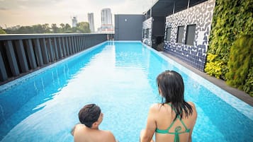 Outdoor pool, open 7:00 AM to 9:00 PM, pool loungers